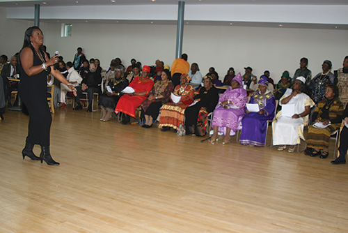 An audience of East Point seniors, many dressed in bright-colored outfits, gathered to listen to a lecture held for Black History Month.