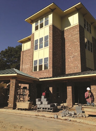 A foreclosed apartment building in the process of redevelopment as a 42-unit senior living facility.