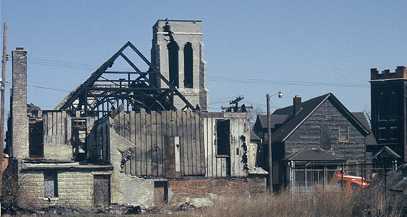 An image of a burned-out church as seen across vacant lots once occupied by dwellings.