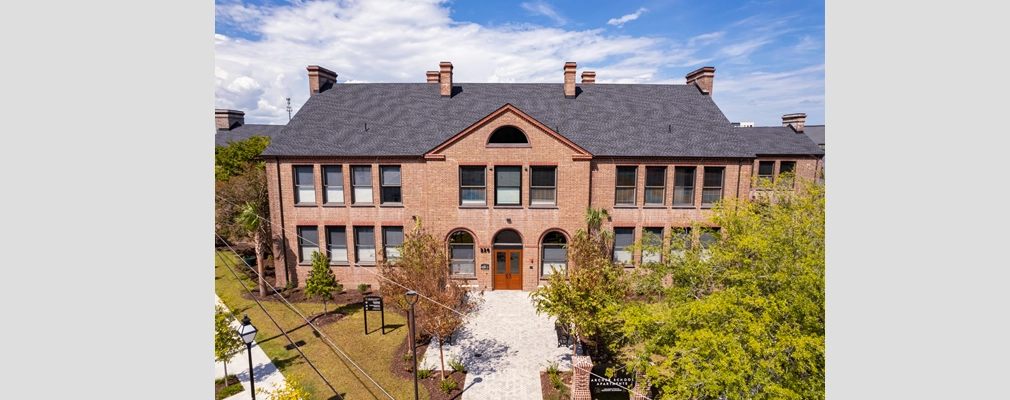 Restored two-story, red-brick school building.