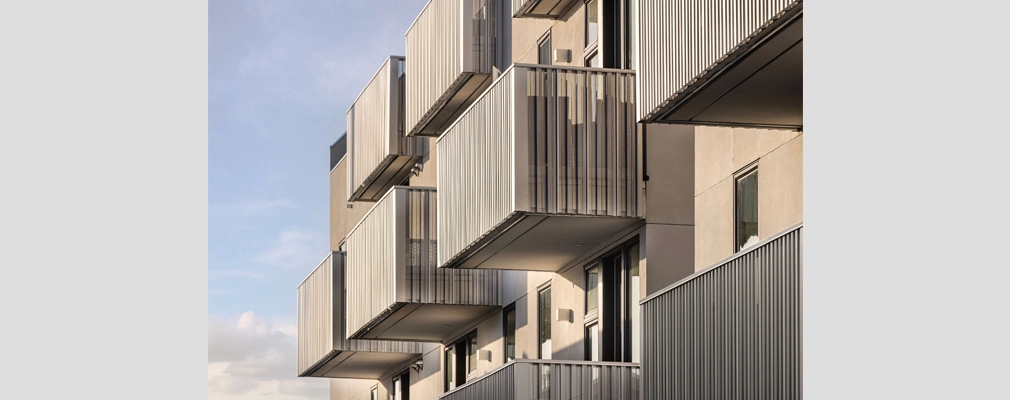 Upper-level view of apartments with balconies.