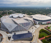 Aerial view of the Mercedes-Benz Stadium and Atlanta Georgia Dome.