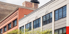 Row of converted old buildings with retail space on the ground floor in downtown Chicago.