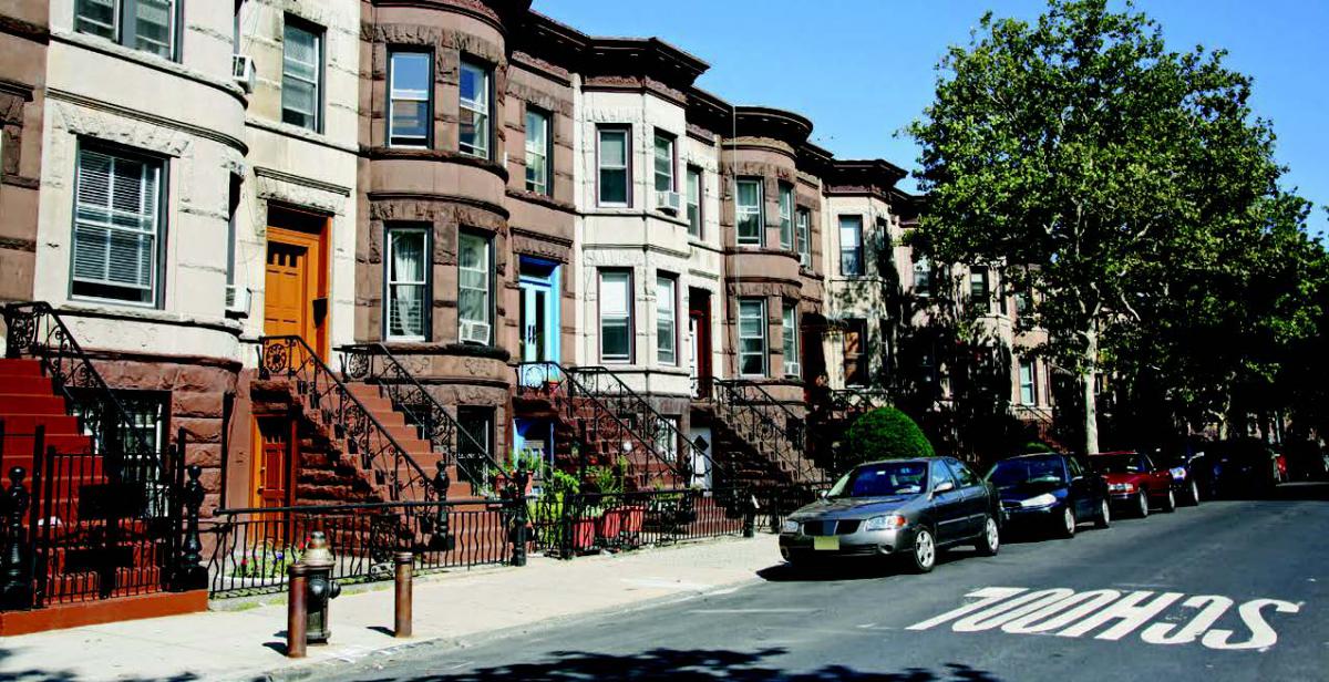 Rowhomes along a street in Brooklyn, New York.