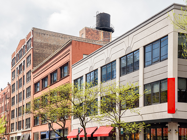 Row of converted old buildings with retail space on the ground floor in downtown Chicago.