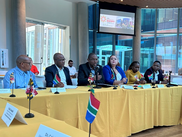 Attendees sitting at a table during the meeting.